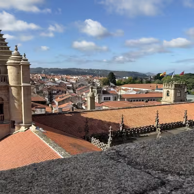 Rooftop view over Santiago de Compostela cathedral towers and red‑tiled old town