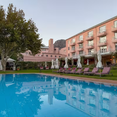 mount nelson pool in cape town with pink building