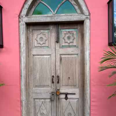 pink wall and antique door Masiya's Camp at Royal Malewane