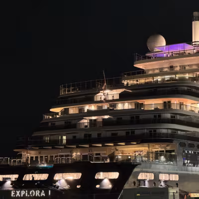 aft of the explora I at night with hints of purple and blue lights