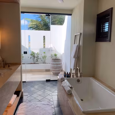 luxurious bathroom at four seasons anguilla with outdoor shower