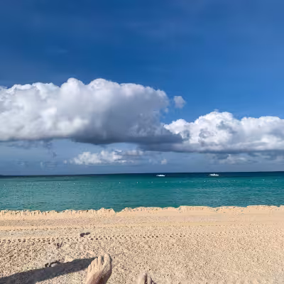 girl on beach in anguilla luxury resort turquoise water