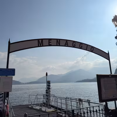 Menaggio ferry dock overlooking Lake Como and the surrounding Italian Alps