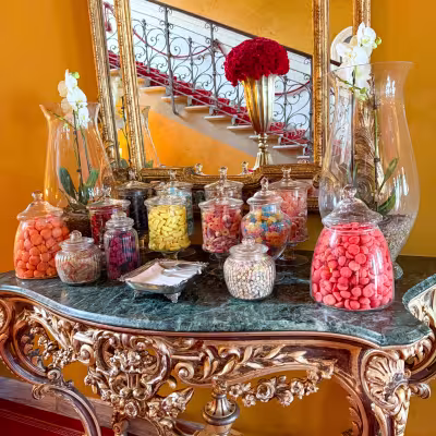Elegant candy display on an antique console table inside a Lake Como villa