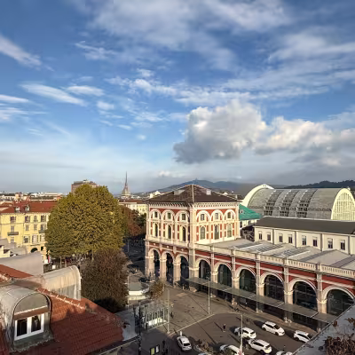 View of Porta Nuova railway station and Turin skyline with the Mole Antonelliana, Italy