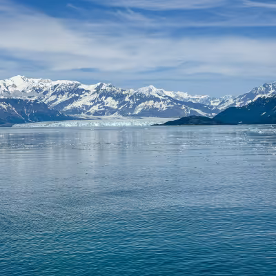 Hubbard Glacier's ice face and snow-capped Alaska mountains, viewed from Regent Seven Seas Explorer