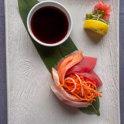 Fresh sashimi platter with salmon, tuna, and yellowtail served aboard Regent Seven Seas Explorer